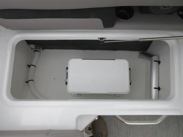 Slide: The Image of 2024 Four Winns HD3 boat storage compartment with white cooler. - 16