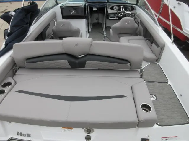 Slide: The Image of 2024 Four Winns HD3 boat interior with gray seating and modern dashboard. - 18