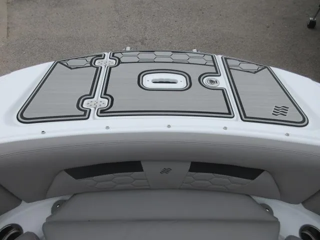 Slide: The Image of 2024 Four Winns HD3 boat stern with cushioned seating and non-slip deck. - 24