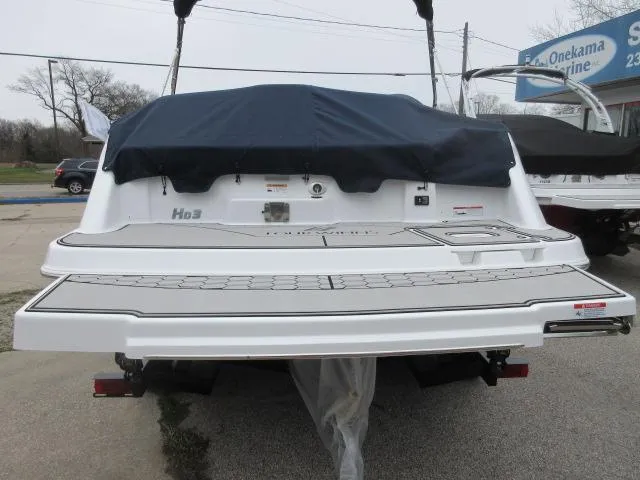 Slide: The Image of 2024 Four Winns HD3 boat with covered stern, displayed at a marina. - 5