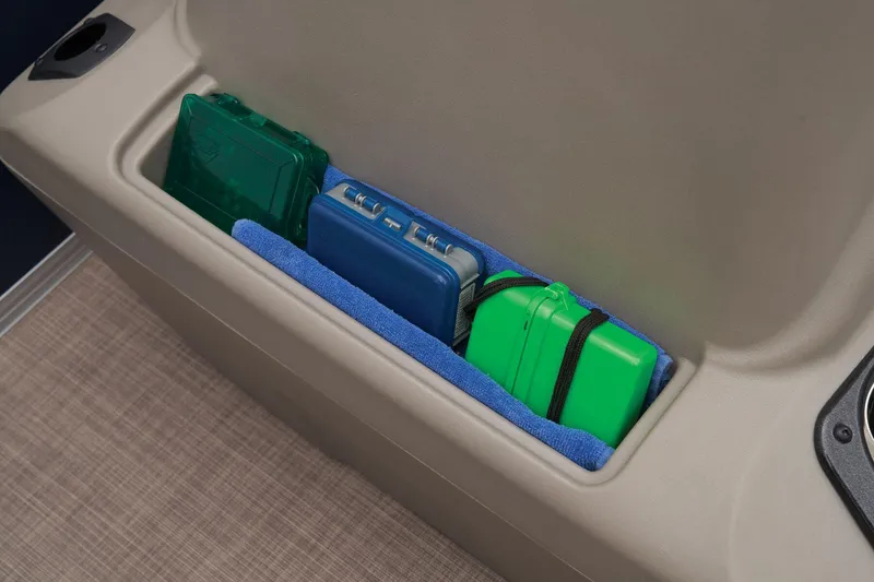 Slide: The Image of Storage compartment on 2024 Sun Tracker Bass Buggy 18 DLX with organized gear. - 31