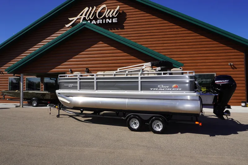 The Image of 2024 Sun Tracker Fishin' Barge 20 DLX pontoon boat outside All Out Marine. - 0