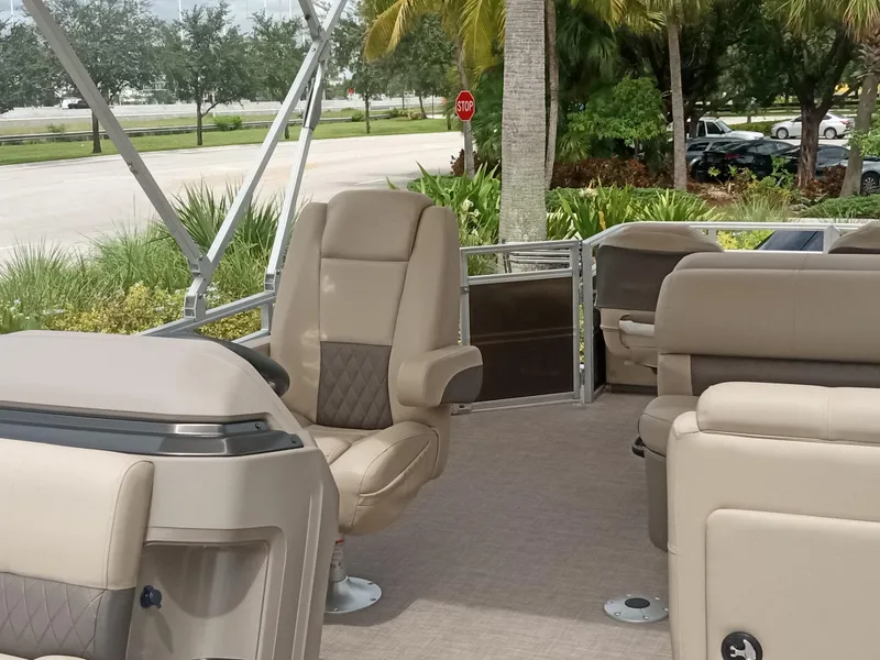 Slide: The Image of 2024 Sun Tracker SportFish 22 XP3 interior with plush seating and modern design. - 2