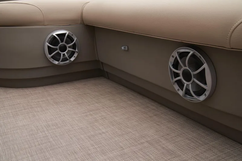 Slide: The Image of Sun Tracker Bass Buggy 18 DLX 2024 interior speakers and seating area. - 46