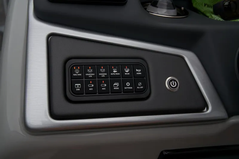 Slide: The Image of Control panel of 2024 Ranger Reata 223FC boat with various function buttons. - 25