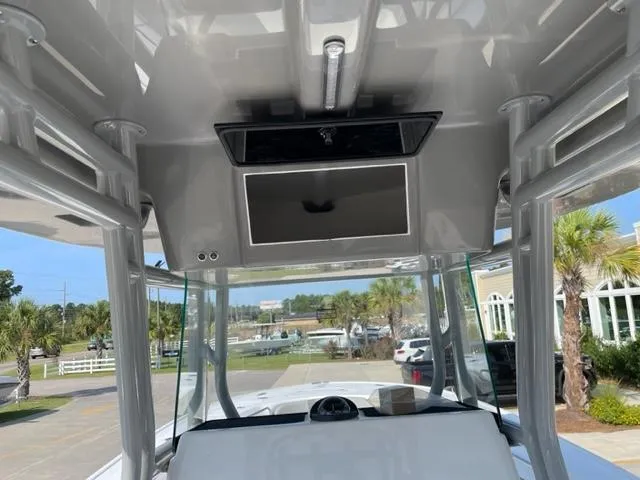 Slide: The Image of 2024 Cape Horn 31T boat interior with overhead console and electronics. - 18