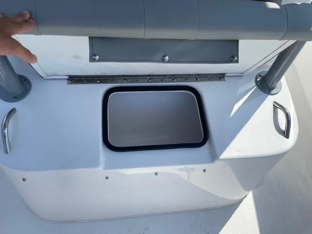 Slide: The Image of 2024 Cape Horn 31T boat storage compartment with cushioned seating. - 26