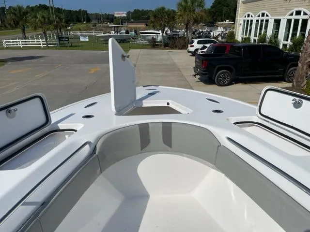 Slide: The Image of 2024 Cape Horn 31T boat with open storage compartments, parked outdoors. - 30