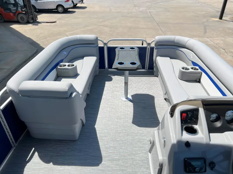 Slide: The Image of 2024 Bennington 20 SVSR pontoon boat interior with gray seating and central table. - 6