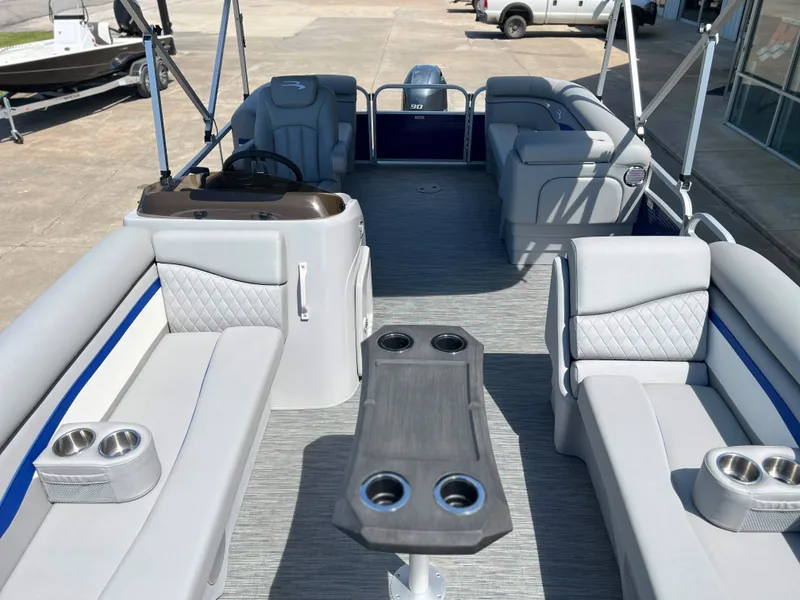 Slide: The Image of 2024 Bennington 20 SVSR pontoon boat interior with seating and cup holders. - 7