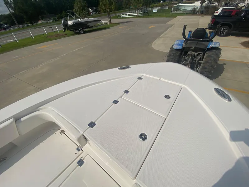 Slide: The Image of 2024 Robalo 266 Cayman boat deck view in a parking lot. - 25