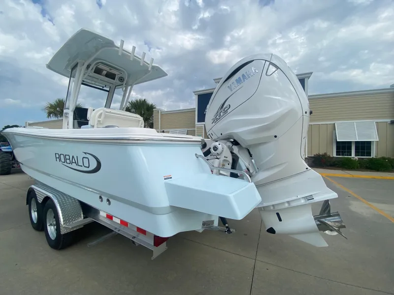Slide: The Image of 2024 Robalo 266 Cayman boat with Yamaha outboard motor on trailer. - 4