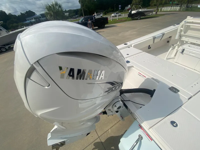 Slide: The Image of 2024 Robalo 266 Cayman with Yamaha outboard motor, rear deck view. - 5