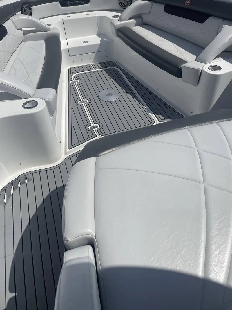 Slide: The Image of 2017 Mystic Powerboats M4200 interior with white leather seating and grey flooring. - 12