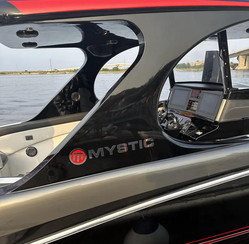Slide: The Image of 2017 Mystic Powerboats M4200 cockpit and dashboard view on the water. - 7