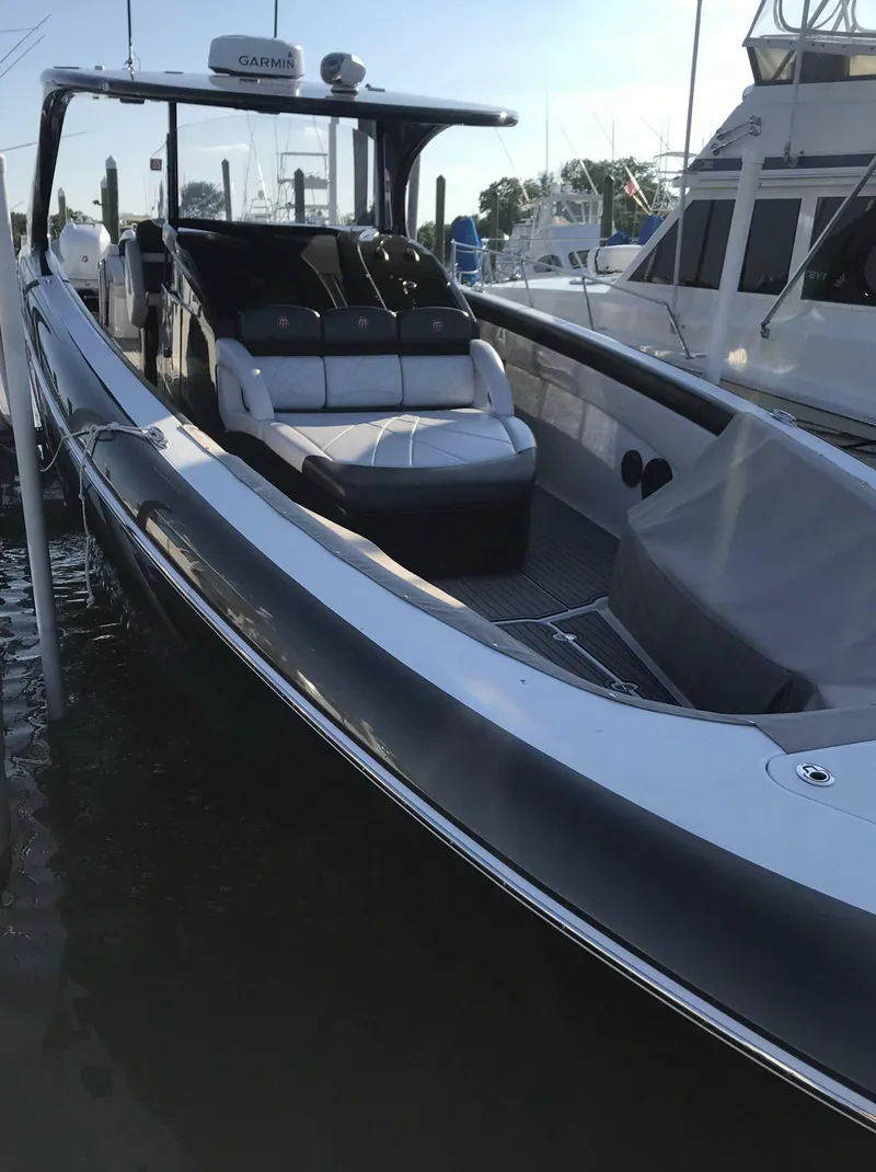 Slide: The Image of 2017 Mystic Powerboats M4200 docked at marina. - 9