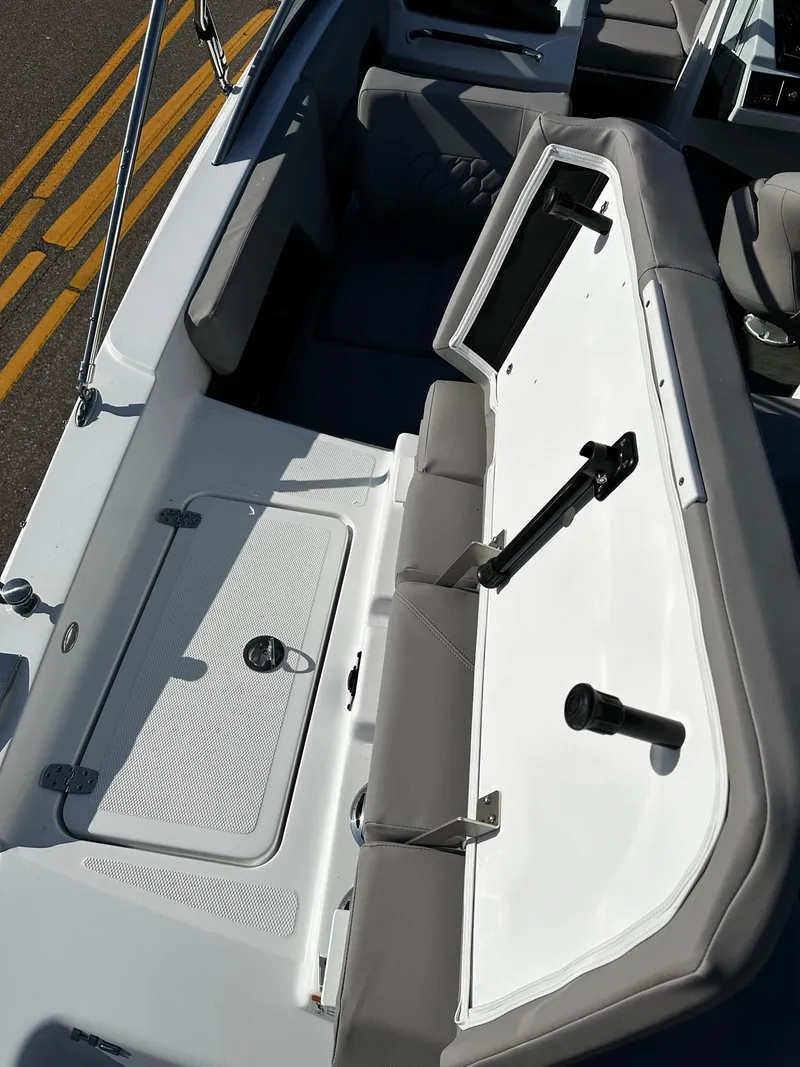 Slide: The Image of 2023 Four Winns H2 boat interior with open storage compartment. - 16