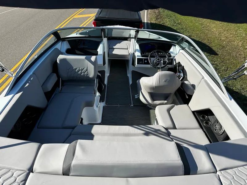 Slide: The Image of 2023 Four Winns H2 boat interior with modern seating and steering console. - 5