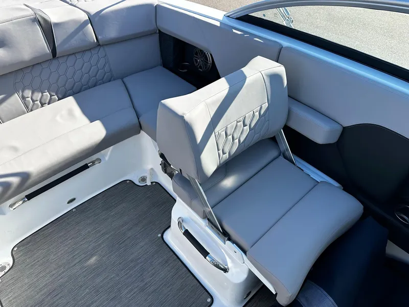 Slide: The Image of 2023 Four Winns H2 boat interior with gray seating and modern design. - 9