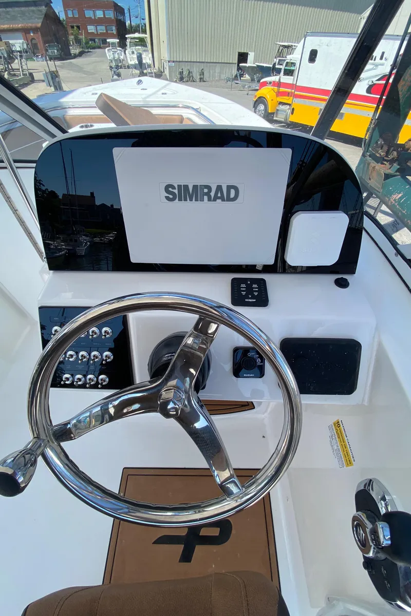 Slide: The Image of 2024 Sea Pro 240 Dual console with Simrad navigation system. - 14