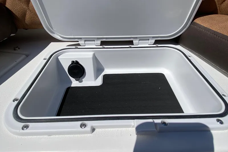 Slide: The Image of Open storage compartment on a 2024 Sea Pro 240 Dual boat. - 16