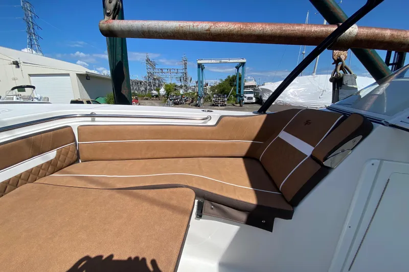 Slide: The Image of 2024 Sea Pro 240 Dual boat with brown cushioned seating. - 17