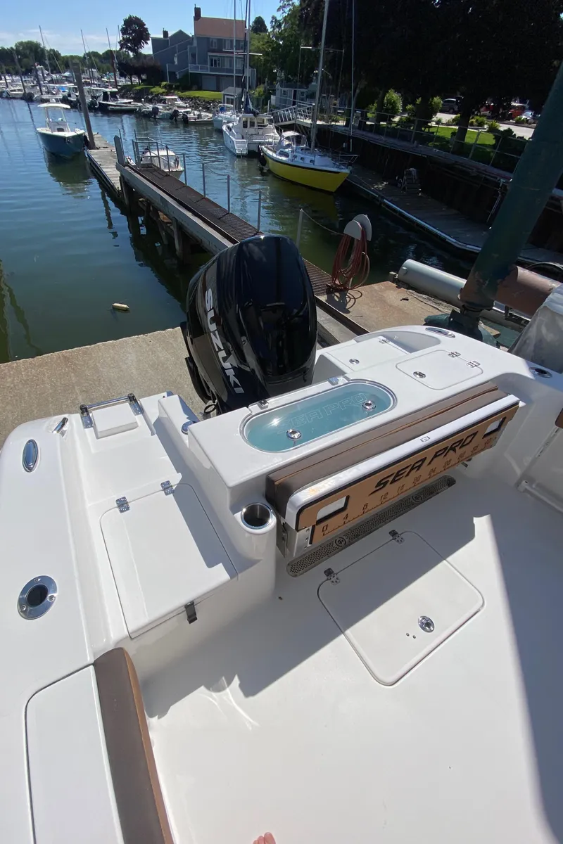 Slide: The Image of 2024 Sea Pro 240 Dual at a marina dock. - 9