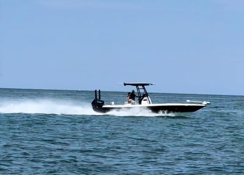 Slide: The Image of 2020 ShearWater 270 Carolina Flare boat speeding on open water. - 0