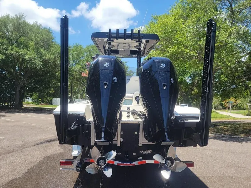 Slide: The Image of 2020 ShearWater 270 Carolina Flare boat with twin outboard engines. - 2
