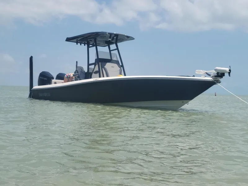 Slide: The Image of 2020 ShearWater 270 Carolina Flare boat anchored in calm waters. - 5