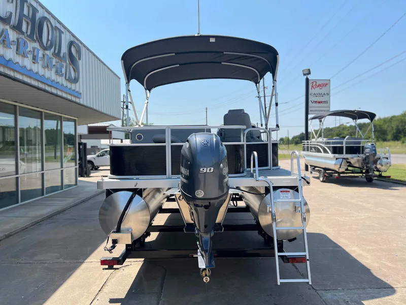 Slide: The Image of 2024 Bennington 20 SVF pontoon boat with 90 HP engine at dealership. - 3