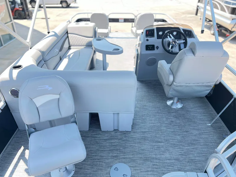 Slide: The Image of 2024 Bennington 20 SVF pontoon boat interior with seating and helm station. - 4