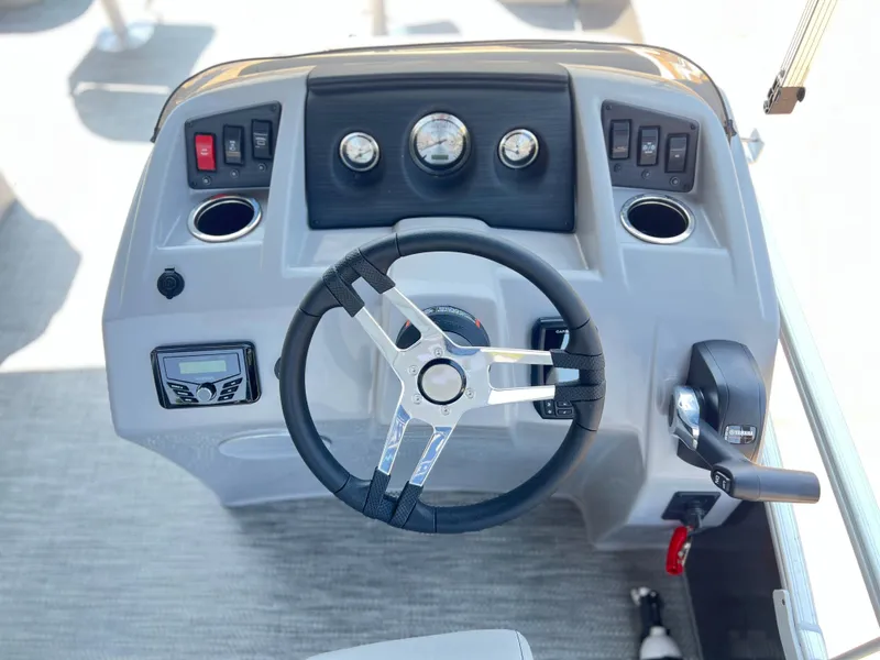Slide: The Image of 2024 Bennington 20 SVF boat dashboard with steering wheel and control panel. - 5
