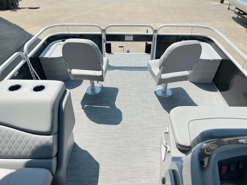 Slide: The Image of 2024 Bennington 20 SVF boat interior with two swivel chairs and gray upholstery. - 6