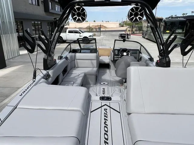 Slide: The Image of 2024 Moomba Craz boat interior with modern seating and advanced audio system. - 10