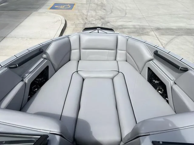 Slide: The Image of 2024 Moomba Craz boat interior with gray cushioned seating. - 12