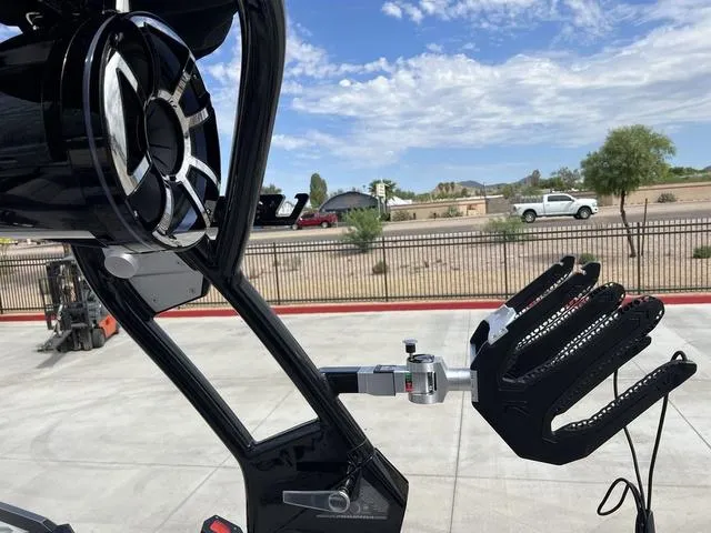 Slide: The Image of 2024 Moomba Craz boat with wakeboard rack and speaker system. - 17