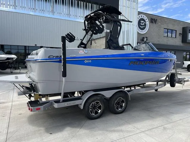 Slide: The Image of 2024 Moomba Craz boat on a trailer outside a dealership. - 3