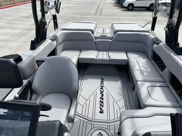 Slide: The Image of 2024 Moomba Craz boat interior with gray seating and flooring. - 9