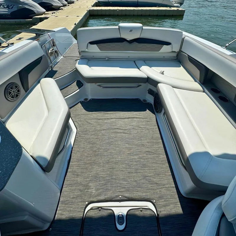 Slide: The Image of 2021 Four Winns HD8 boat docked on a sunny day. - 2