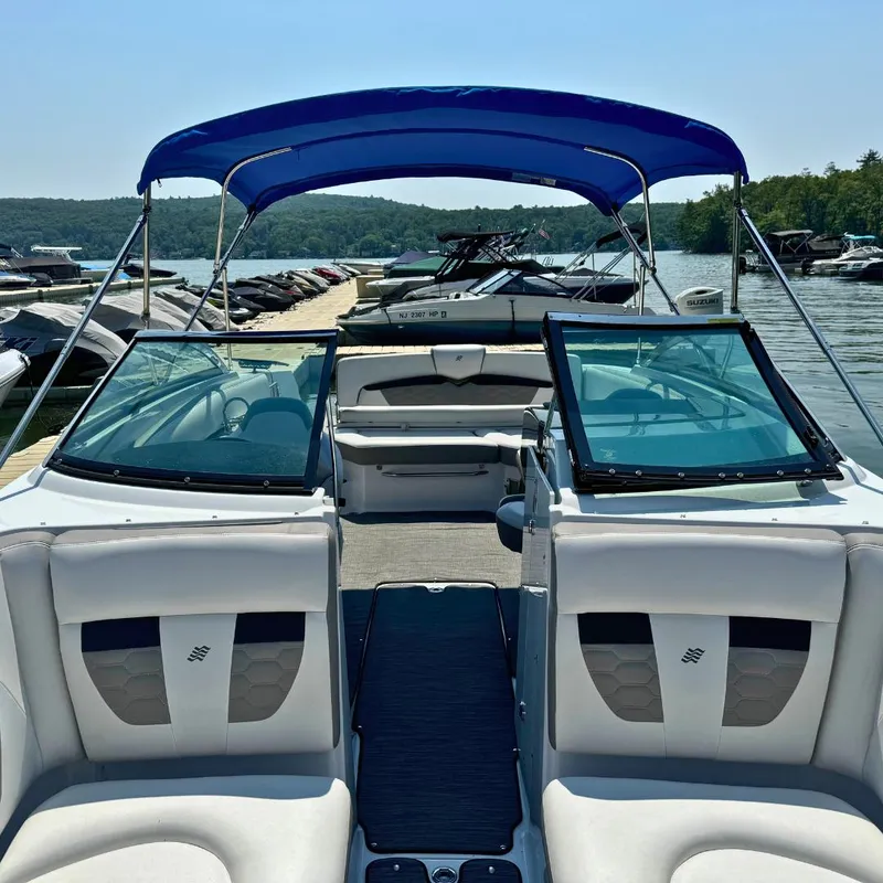 Slide: The Image of 2021 Four Winns HD8 boat dashboard with steering wheel and instrument panel. - 7