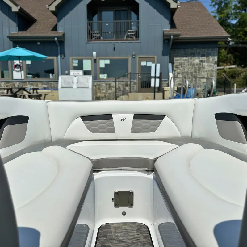 Slide: The Image of 2021 Four Winns HD8 boat interior bathroom with toilet and sink. - 8