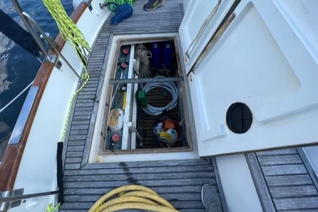 Slide: The Image of Open deck storage on 1987 Grand Banks 42 Classic Trawler, showing ropes and equipment. - 36