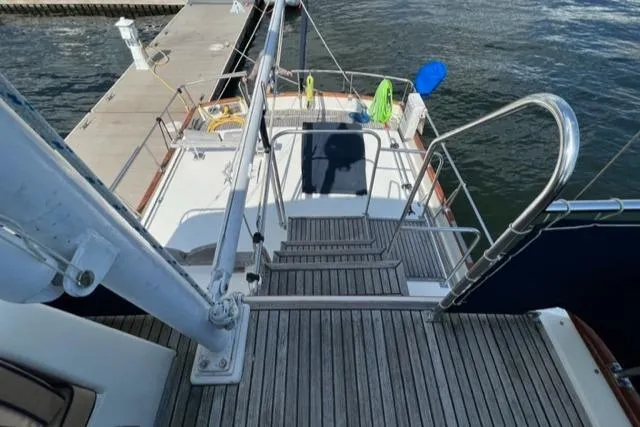 Slide: The Image of 1987 Grand Banks 42 Classic Trawler docked, view of deck and railing. - 42