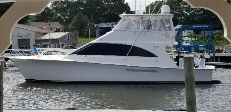 The Image of 2001 Ocean Yachts 56 Super Sport boat docked at a marina, side view. - 0