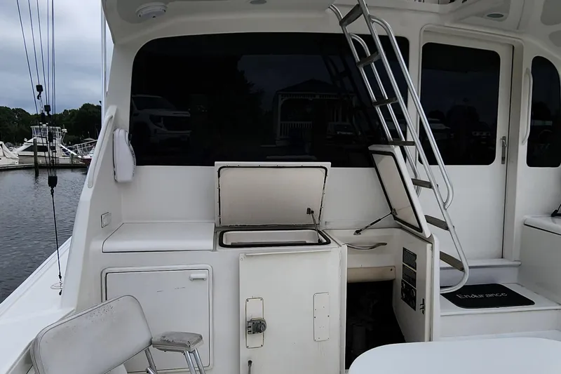 Slide: The Image of 2001 Ocean Yachts 56 Super Sport yacht deck with seating and ladder. - 23