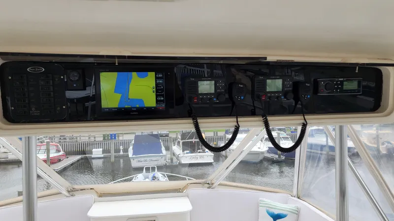 Slide: The Image of Control panel of a 2001 Ocean Yachts 56 Super Sport with navigation and communication equipment. - 34