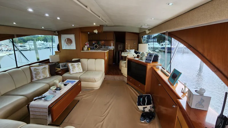 Slide: The Image of Luxurious interior of a 2001 Ocean Yachts 56 Super Sport with elegant furnishings and marina view. - 39