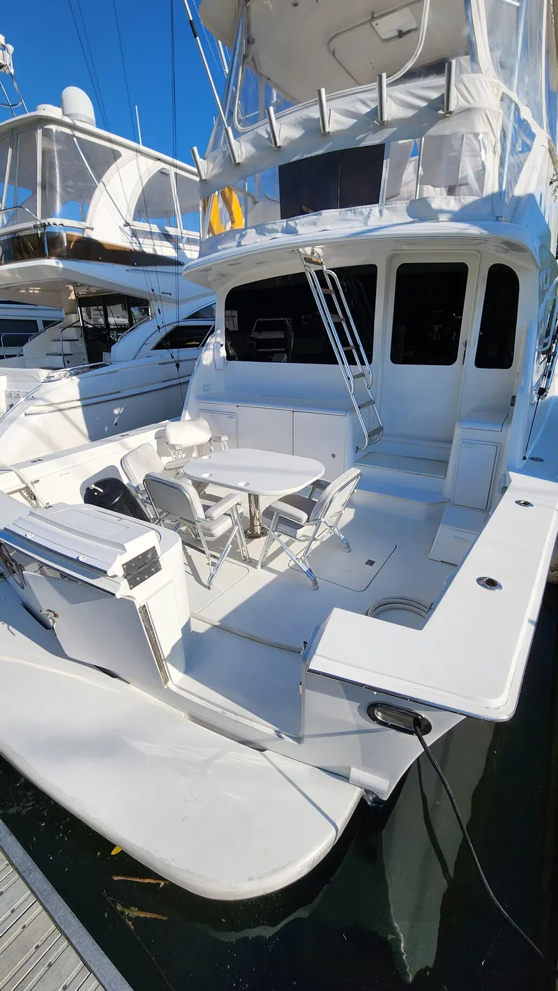 Slide: The Image of 2001 Ocean Yachts 56 Super Sport with spacious deck and seating area. - 5