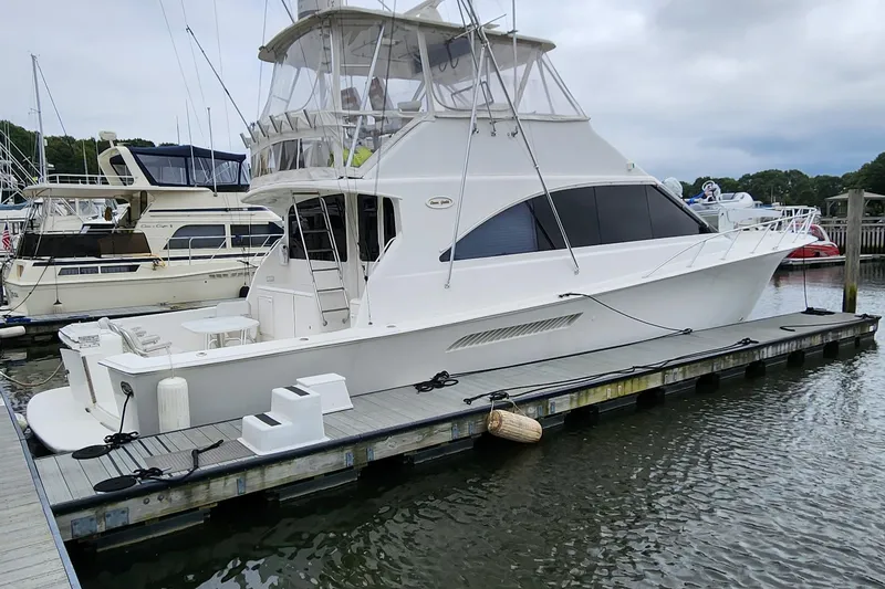 Slide: The Image of 2001 Ocean Yachts 56 Super Sport docked at marina, side view. - 12